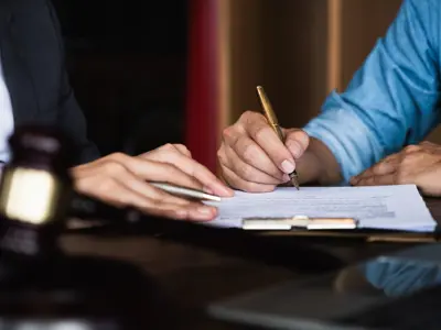 Two people reviewing document